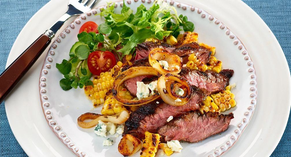 Marinated Hanger Steak with Grilled Onions Sweet Corn and Blue Cheese