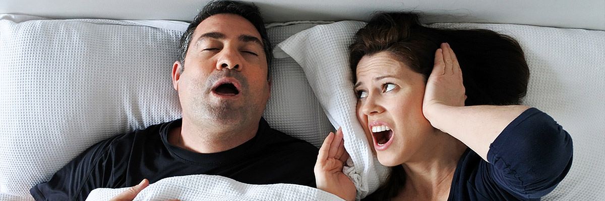 woman can't sleep cause of husband's snoring