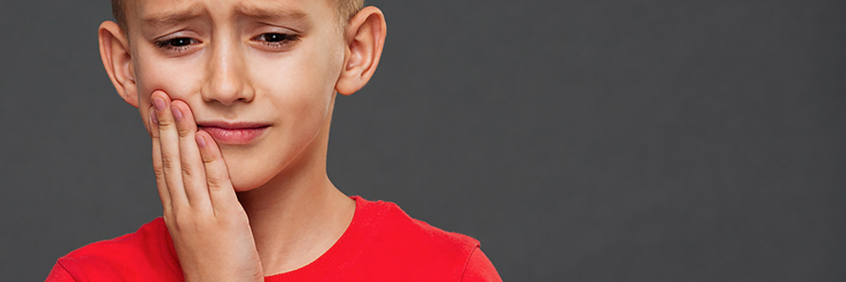 boy with jaw pain