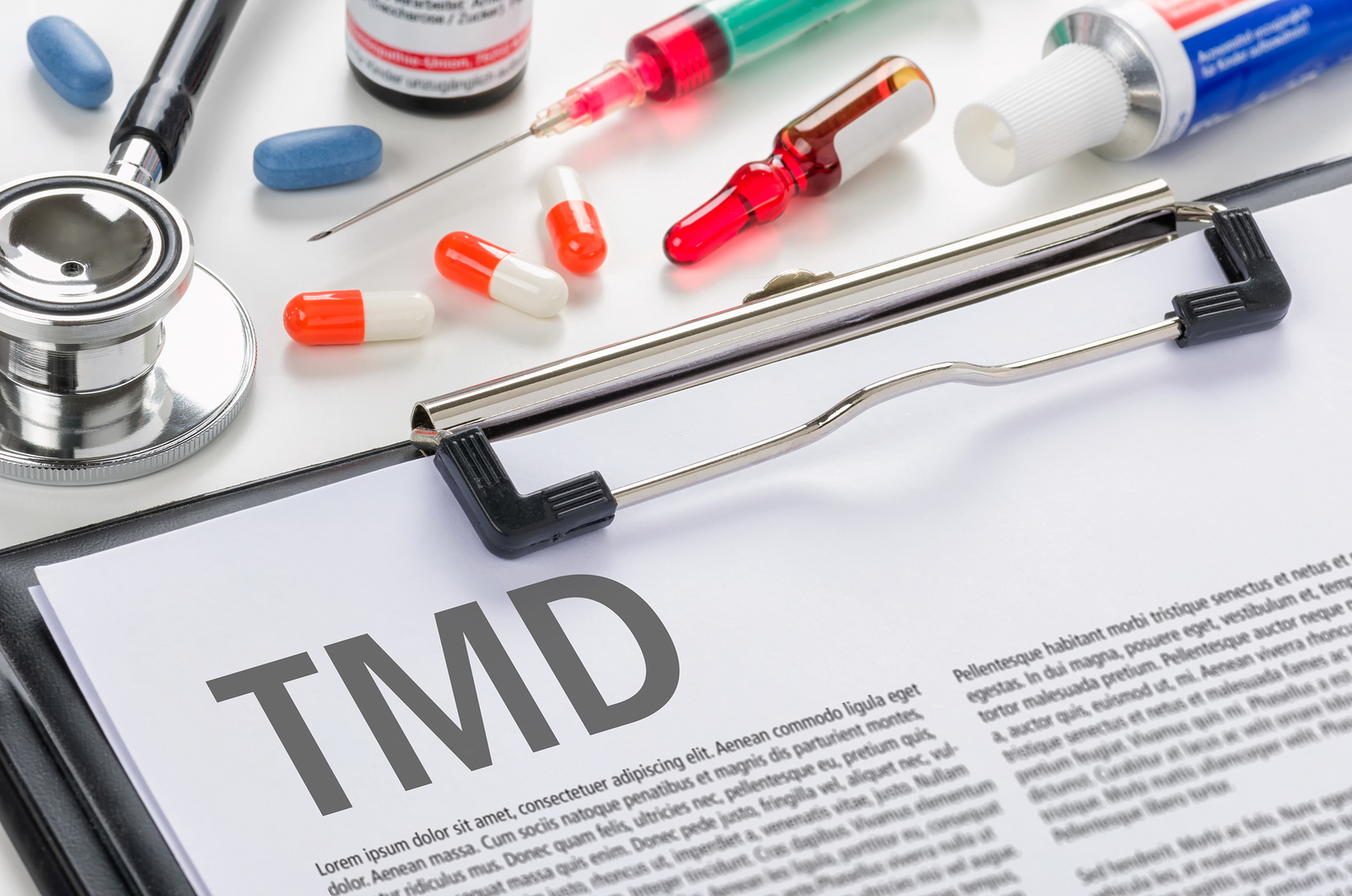 The diagnosis TMD written on a clipboard