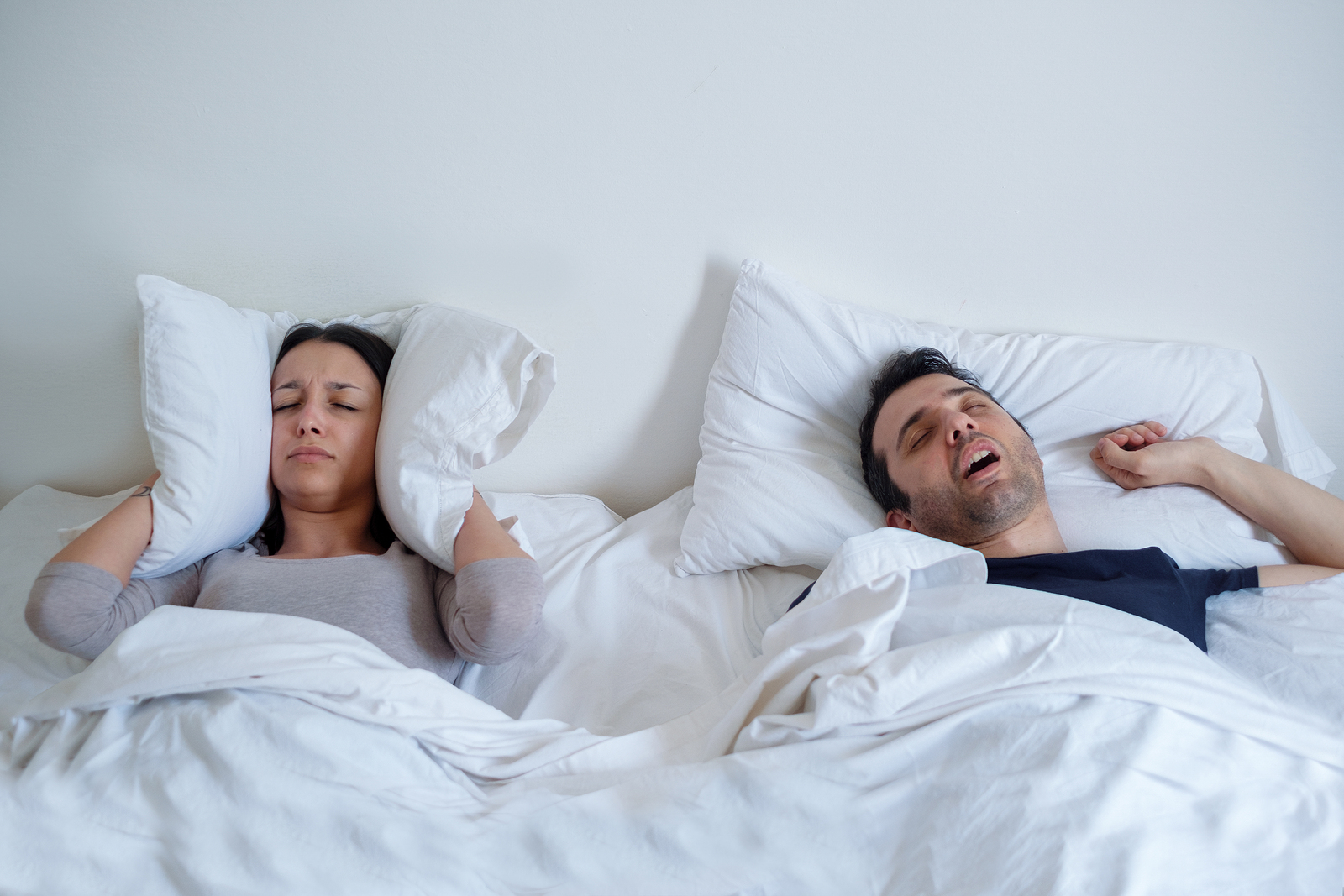 Woman cant sleep because her boyfriend is snoring loudly